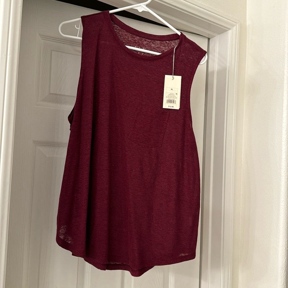 More burgundy wine than red, light weight, casual top.